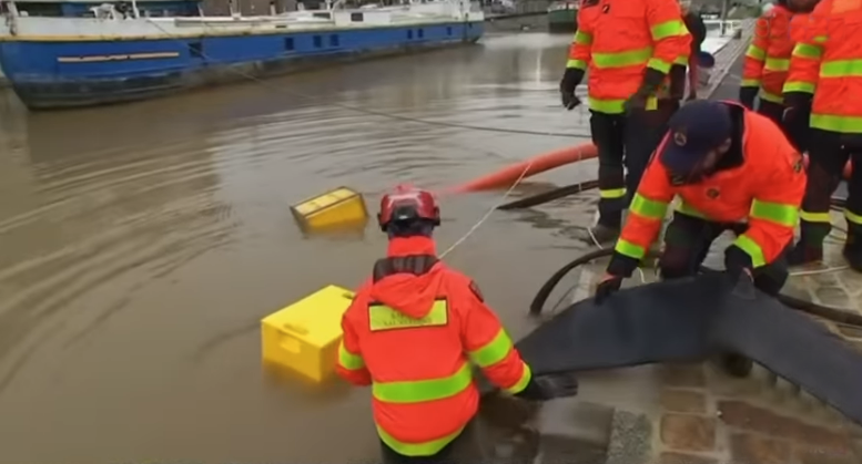 Flood response team deploying modular flood equipment